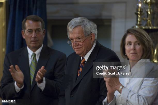 House Minority Leader John A. Boehner, R-Ohio, former House Speaker J. Dennis Hastert, R-Ill., and House Speaker Nancy Pelosi, D-Calif., during the...