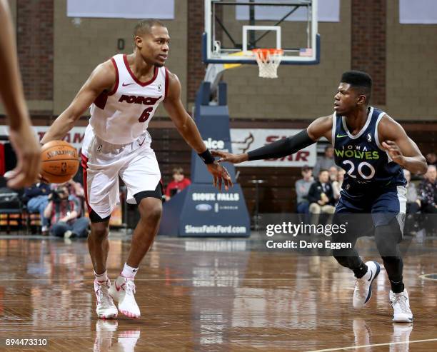 Matt Williams Jr. #6 of the Sioux Falls Skyforce dribbles the ball past the defense of Wes Washpun of the Iowa Wolves during an NBA G-League game on...