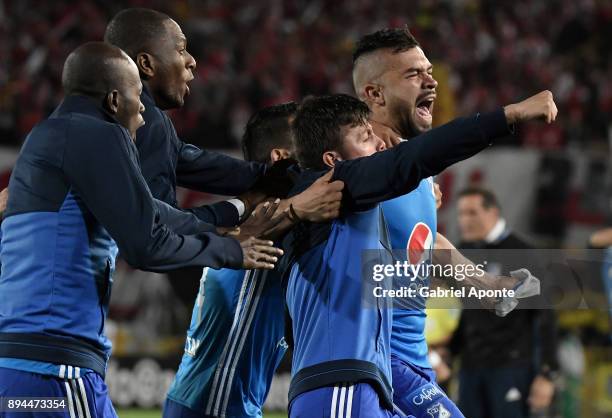 Andres Cadavid of Millonarios celebrates with teammates after scoring the first goal of his team during the second leg match between Millonarios and...