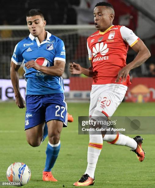 John Pajoy of Santa Fe struggles for the ball with Jhon Duque Arias of Millonarios during the second leg match between Millonarios and Santa Fe as...