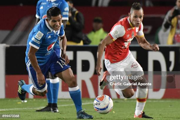 Anderson Plata of Santa Fe struggles for the ball with David Macalister Silva of Millonarios during the second leg match between Millonarios and...