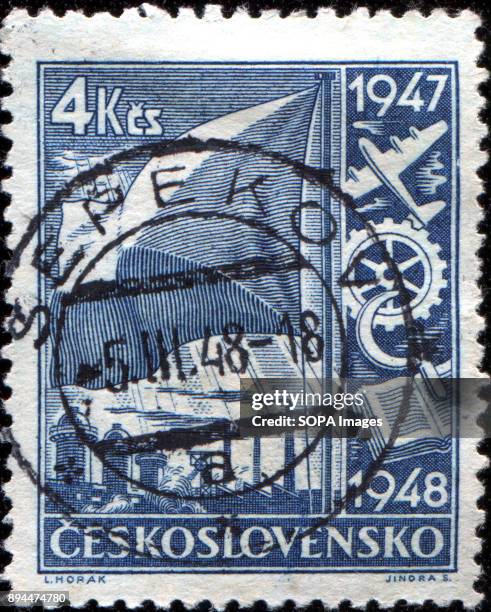 Stamp printed in Czechoslovakia shows Flag and Symbols of Transport, Industry, Agriculture and Learning.