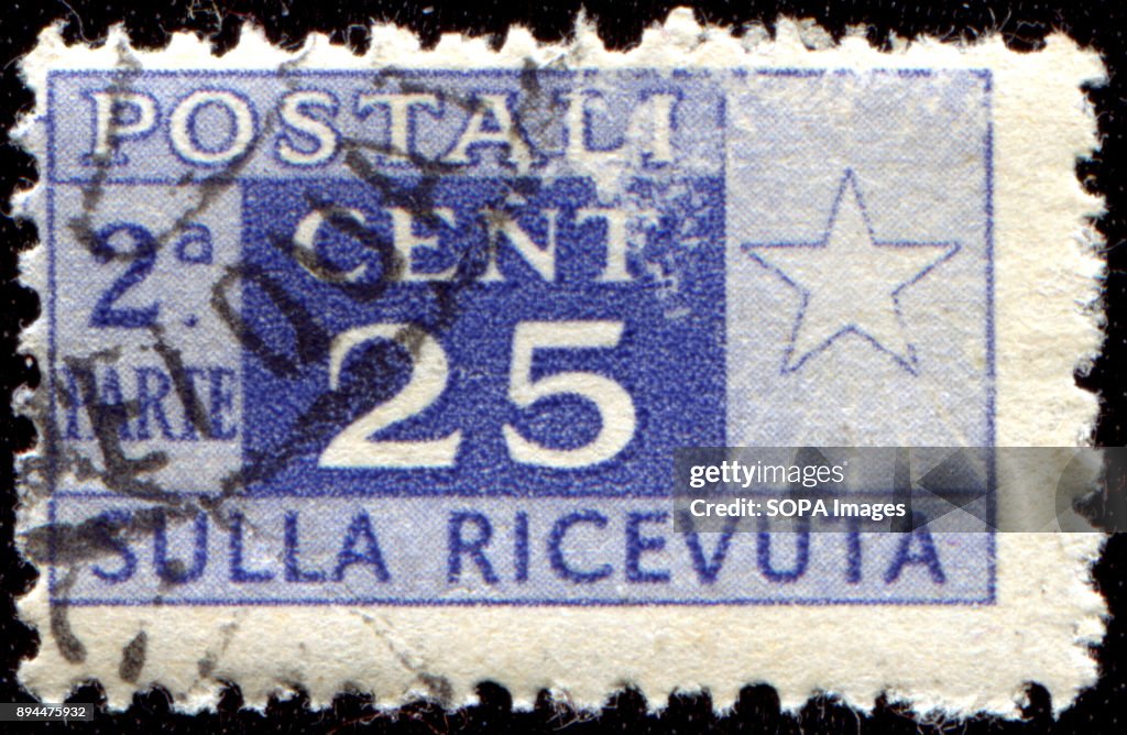 CIRCA 1946: A postage stamps printed in Italy (half affixed...