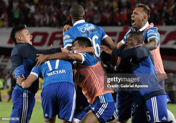 Henry Rojas of Millonarios celebrates with teammates after scoring the second of his team during the second leg match between Millonarios and Santa...