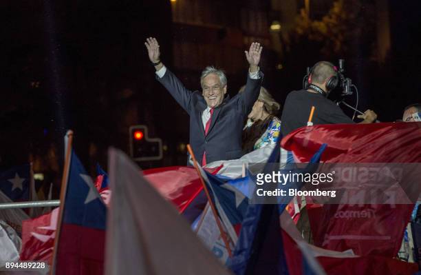 Sebastian Pinera, Chile's president-elect, greets his supporters at the National Renewal party headquarters after the second round presidential...