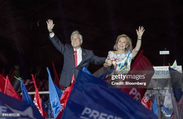 Sebastian Pinera, Chile's president-elect, and wife Cecilia Morel, greet his supporters at the National Renewal party headquarters after the second...