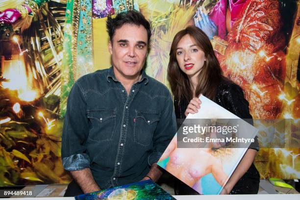 Photographer David LaChapelle and Charlotte Taschen attend the David LaChapelle book signing at TASCHEN Store Beverly Hills on December 17, 2017 in...