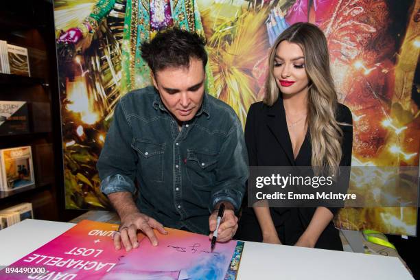 Photographer David LaChapelle and Emily Sears attend the David LaChapelle book signing at TASCHEN Store Beverly Hills on December 17, 2017 in Beverly...