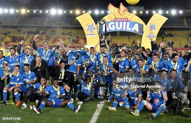 Team members of Millonarios a celebrate with the trophy after winning the second leg match between Millonarios and Santa Fe as part of the Liga...