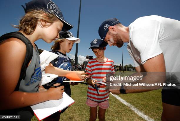 Sam Docherty of the Blues signs autographs during the Carlton Blues AFL pre-season training session at Maroochydore Multisport Complex on December...