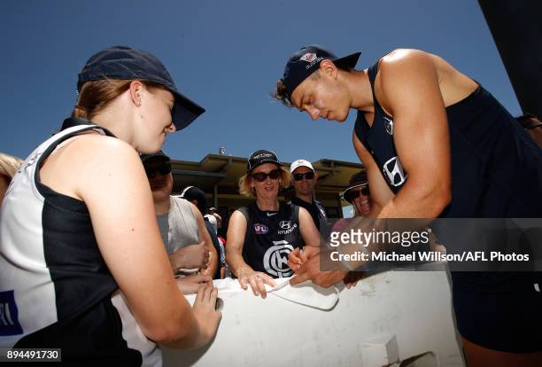 Patrick Cripps of the Blues signs autographs during the Carlton Blues AFL pre-season training session at Maroochydore Multisport Complex on December...