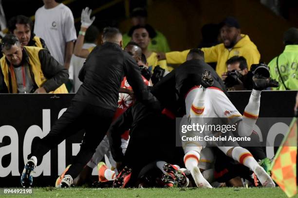 Wilson Morelo of Santa Fe celebrates with teammates after scoring the secong goal of his team during the second leg match between Millonarios and...