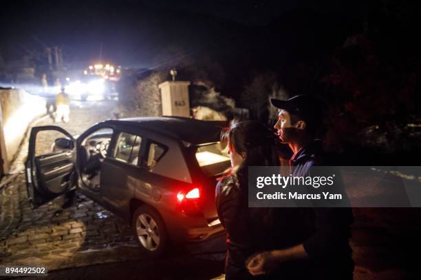 Nicholas Behrman and his fiancee Christina Cila, embrace each other after Cila arrived to see Behrman's destroyed home for the first time, after...