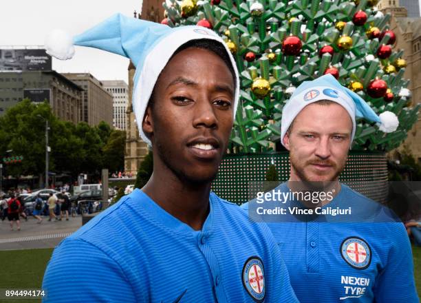 Scott Jamieson and Bruce Kamau of Melbourne City pose at the Christmas site during an A-League media opportunity at Federation Square on December 18,...