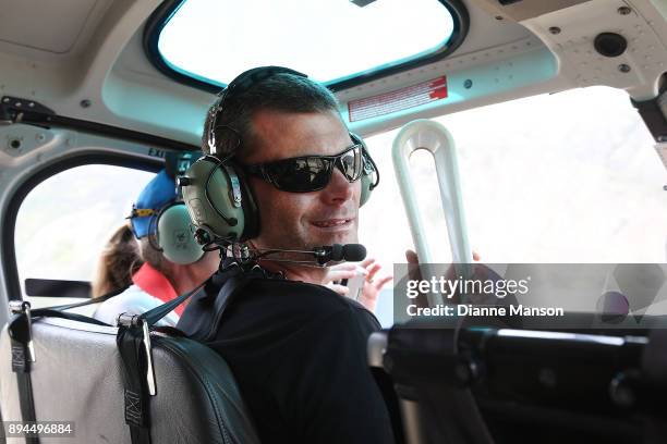 New Zealand athlete Matt Randall holds the Commonweath Queen's baton on the return trip by helicopter from Nevis Bungi during the Commonweath Games...