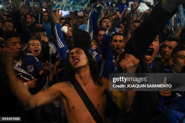 Millonarios supporters celebrate the championship after drawing 2-2 in their Football League final match against Santa Fe at the Simon Bolivar Park...