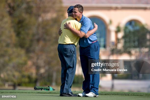 Jack Nicklaus and his grandson Gary Nicklaus Jr. Hug on the 18th green after the final round of the PNC Father/Son Challenge at The Ritz-Carlton Golf...