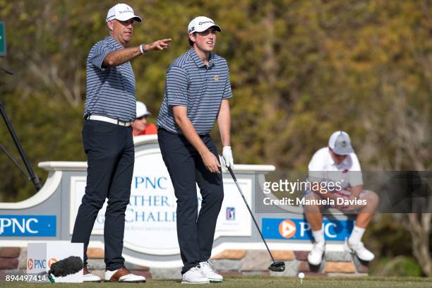 Stewart and Reagan Cink discuss a tee shot on the 18th tee during the final round of the PNC Father/Son Challenge at The Ritz-Carlton Golf Club on...