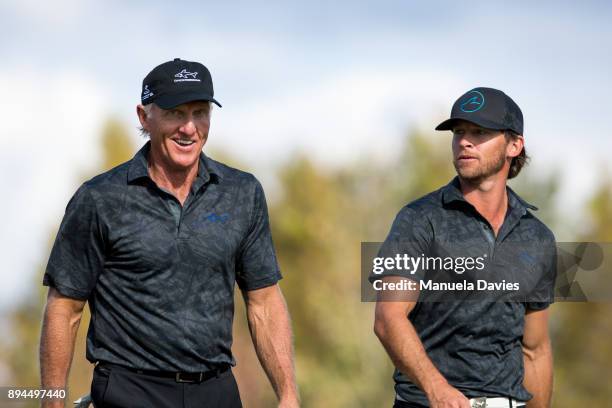 Greg Norman and Greg Norman Jr. Walk on the 18th fairway during the final round of the PNC Father/Son Challenge at The Ritz-Carlton Golf Club on...