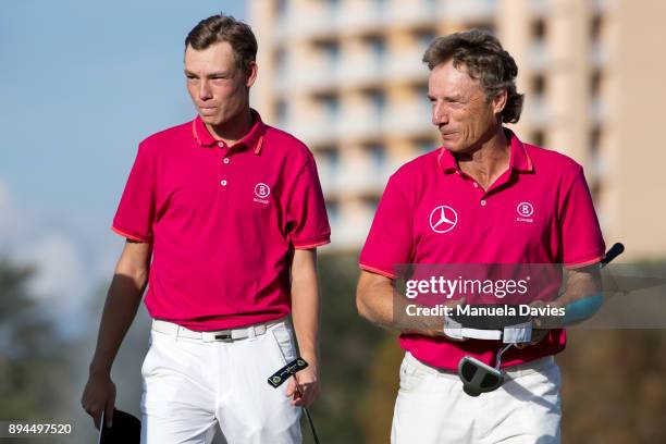 Bernhard and Jason Langer of Germany on the 18th green after their final round of the PNC Father/Son Challenge at The Ritz-Carlton Golf Club on...