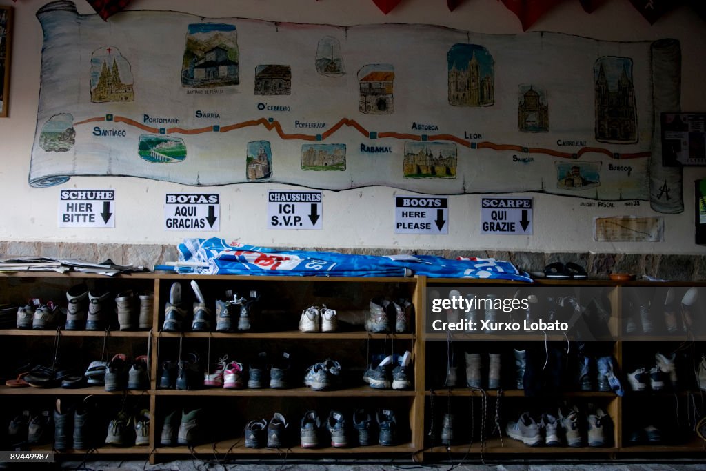 The Way of Saint James. Hostal Pilar. Rabanal del Camino. Len. Boots of pilgrim and map.
