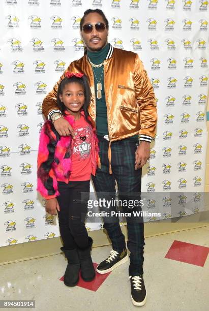 Rapper Future poses with His Daughter Londyn Wilburn at His 5th annual FreeWishes Foundation Winter Wishland at Bessie Branham Park on December 17,...