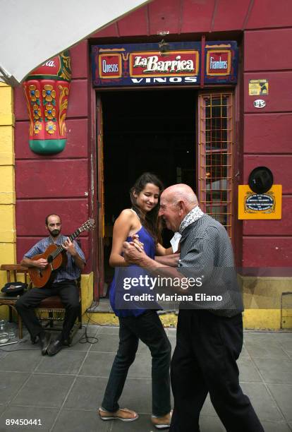 Buenos Aires. Argentina. Street in La Boca. La Boca is a typical neighborhood with irregular streets and high paths that protect the housings of...