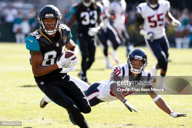 Wide Receiver Keelan Cole of the Jacksonville Jaguars makes a catch over Cornerback Kevin Johnson of the Houston Texans during the game at EverBank...
