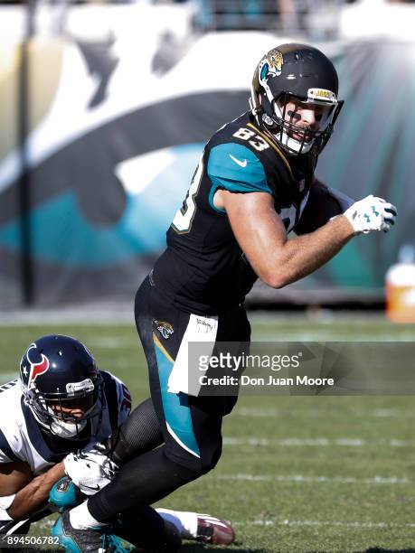 Tight End Ben Koyack of the Jacksonville Jaguars is tackled by the ankles by Cornerback Kevin Johnson the Houston Texans during the game at EverBank...