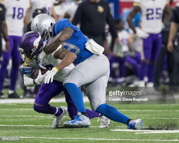 Tahir Whitehead of the Detroit Lions tackles Jarius Wright of the Minnesota Vikings during an NFL game at Ford Field on November 23, 2016 in Detroit,...