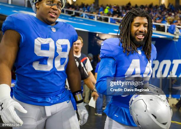 Jeremiah Ledbetter and Jalen Reeves-Maybin of the Detroit Lions head back out to the field to start the second half against the Minnesota Vikings...