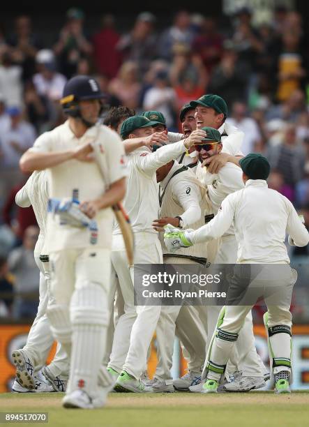 Ausralia celebrate after Pat Cummins of Australia claiimed the fianl wicket of Chris Woakes of England to claim victory during day five of the Third...