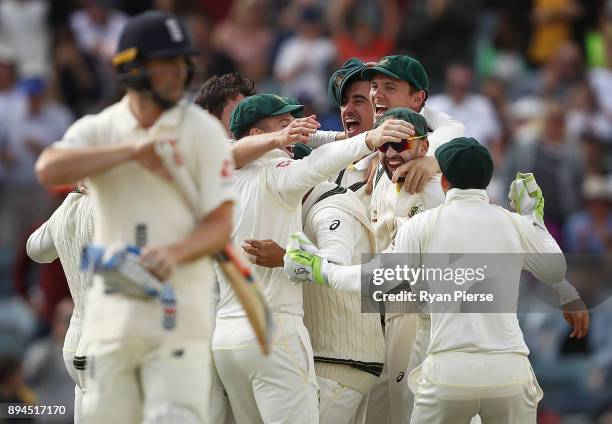 Ausralia celebrate after Pat Cummins of Australia claimed the final wicket of Chris Woakes of England to claim victory during day five of the Third...