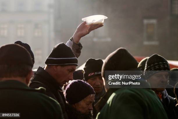 Hundreds of people came for a warm meal to the Christmas Eve Supper for the homeless and poor at the Main Square in Krakow, Poland on 17 December,...