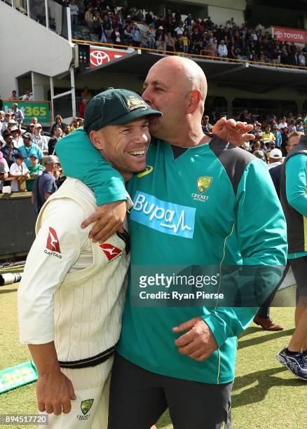 David Warner of Australia and Australian Head Coach Darren Lehmann celebrate after Australian claimed victory during day five of the Third Test match...