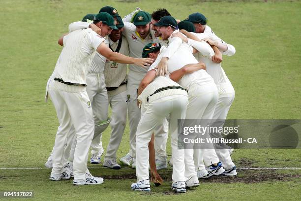 Australia celebrate after defeating England to retake the Ashes during day five of the Third Test match during the 2017/18 Ashes Series between...