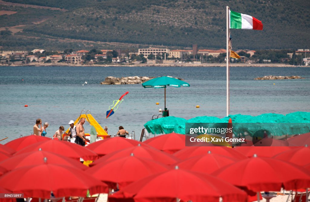 Alghero. Sardinia. Beach of San Giovanni. Located on the northwest coast of Sardinia, Alghero has become a major holiday destination in recent years and yet still retains its distinctive Catalan character. This derives from the influence of Pedro IV of Ar