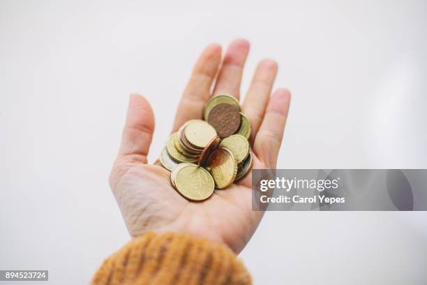 woman hands holding some coins - women euro 2017 stock-fotos und bilder