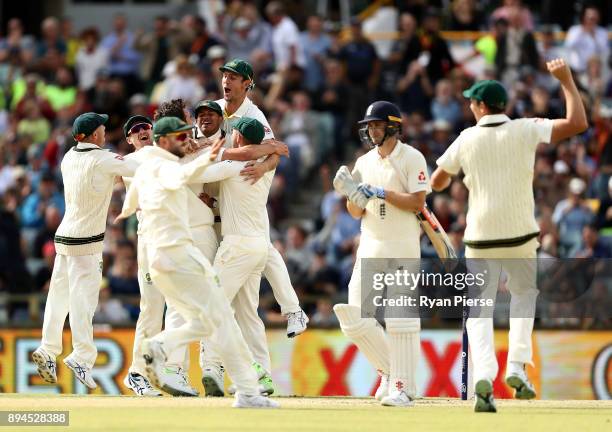 Australia celebrate after Pat Cummins of Australia claimed the final wicket of Chris Woakes of England to claim victory during day five of the Third...