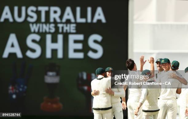 Australia celebrate after they defeated England to win the Ashes during day five of the Third Test match during the 2017/18 Ashes Series between...
