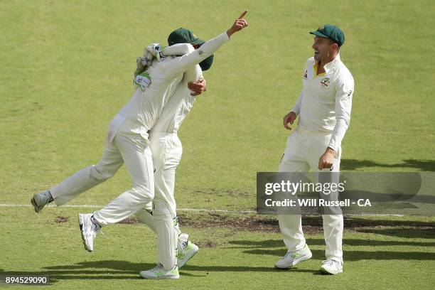 Australia celebrate after defeating England to retake the Ashes during day five of the Third Test match during the 2017/18 Ashes Series between...