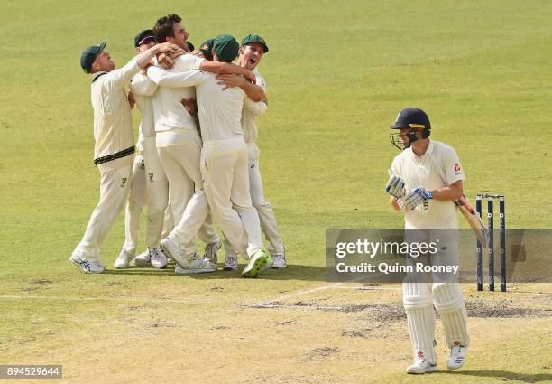 Ausralia celebrate after Pat Cummins of Australia claimed the final wicket of Chris Woakes of England to claim victory during day five of the Third...