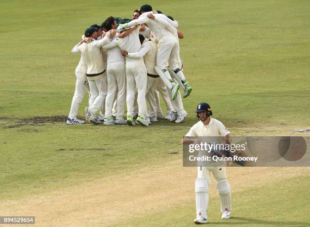 Ausralia celebrate after Pat Cummins of Australia claimed the final wicket of Chris Woakes of England to claim victory during day five of the Third...