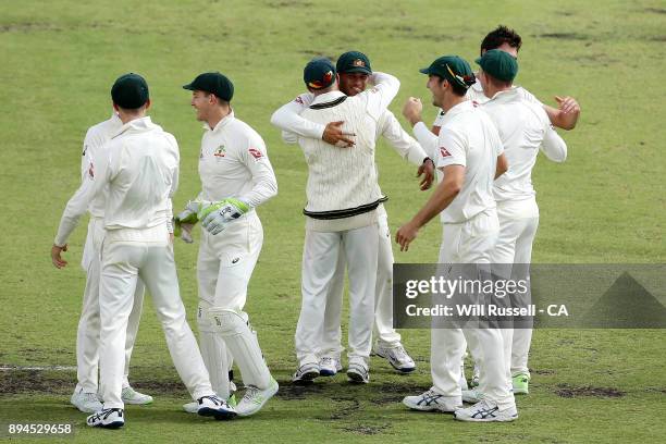 Australia celebrate after defeating England to retake the Ashes during day five of the Third Test match during the 2017/18 Ashes Series between...