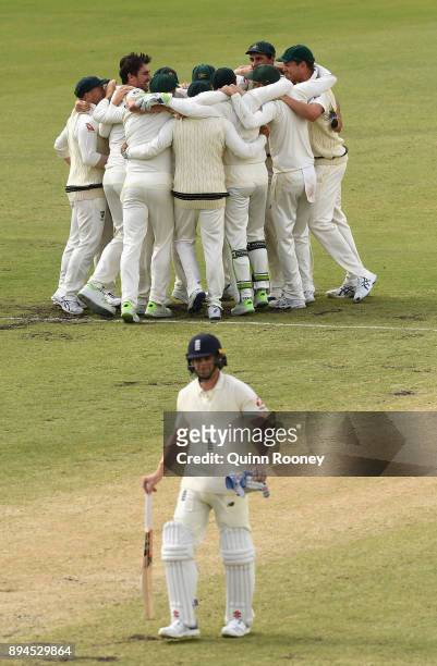 Ausralia celebrate after Pat Cummins of Australia claimed the final wicket of Chris Woakes of England to claim victory during day five of the Third...