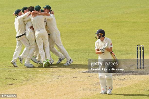 Ausralia celebrate after Pat Cummins of Australia claimed the final wicket of Chris Woakes of England to claim victory during day five of the Third...