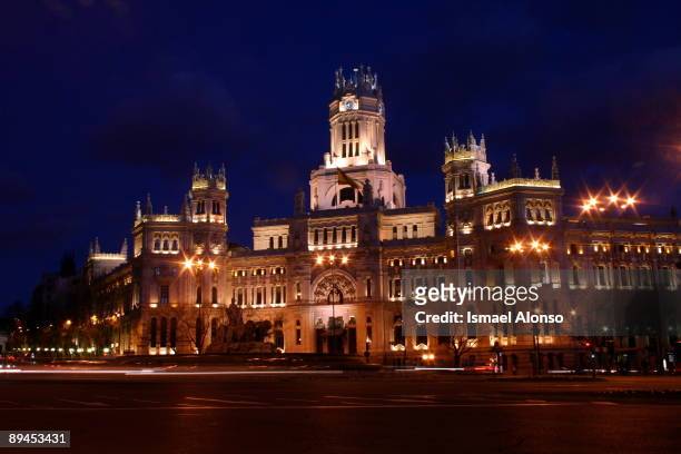 Night view of a lighted up Palacio de Comunicaciones. The Communication Palace was built between 1905 and 1919 according to the project by Antonio...