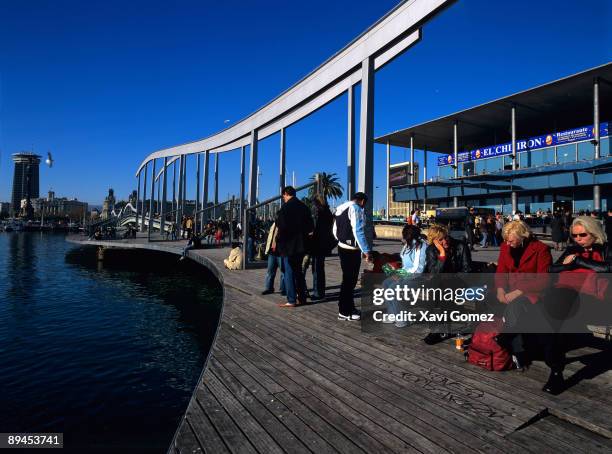 Barcelona. Cataluna. Rambla de Mar. People siting in a bench.