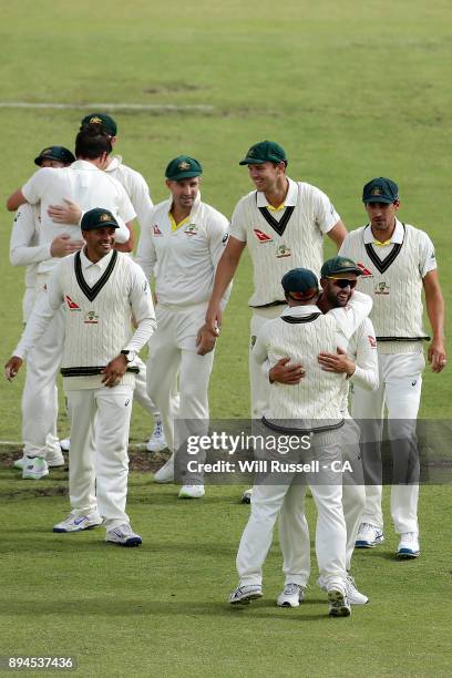 Australia celebrate after defeating England to retake the Ashes during day five of the Third Test match during the 2017/18 Ashes Series between...