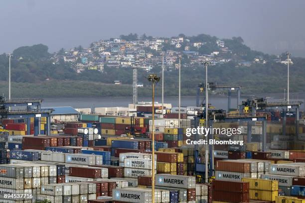 Shipping containers sit stacked at the Jawaharlal Nehru Port, operated by Jawaharlal Nehru Port Trust , in Navi Mumbai, Maharashtra, India, on...